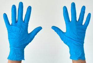 Hands in the blue gloves