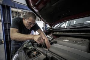 man fixing the car