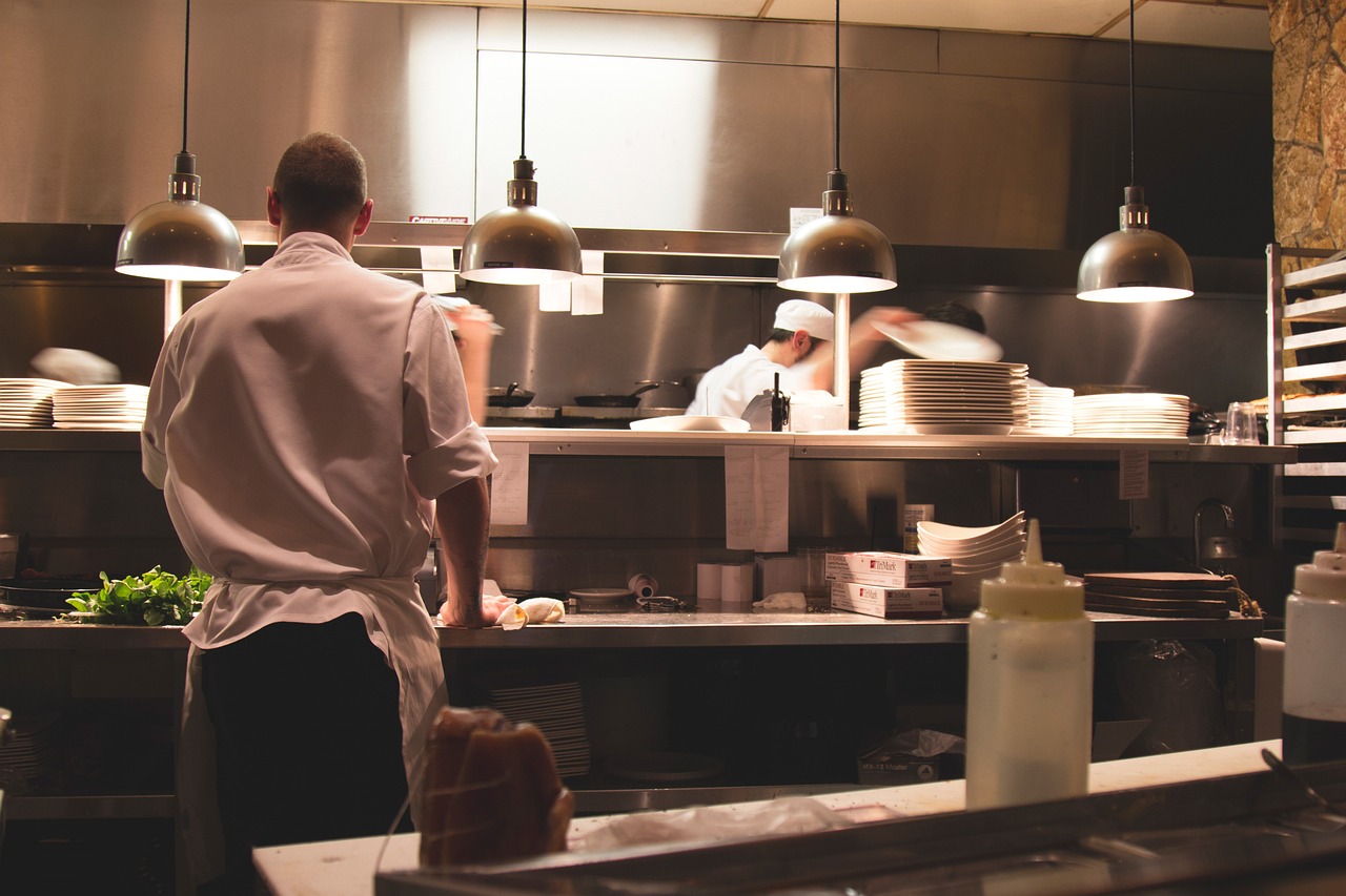 Kitchen in the restaurant with chef cooking