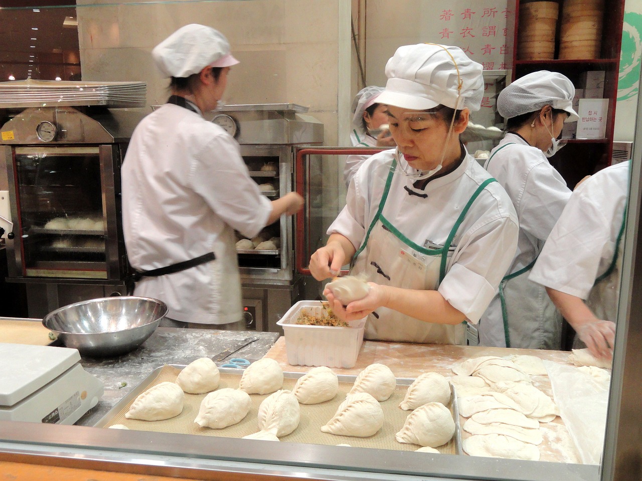 woman preparing food in restaurant's kichen